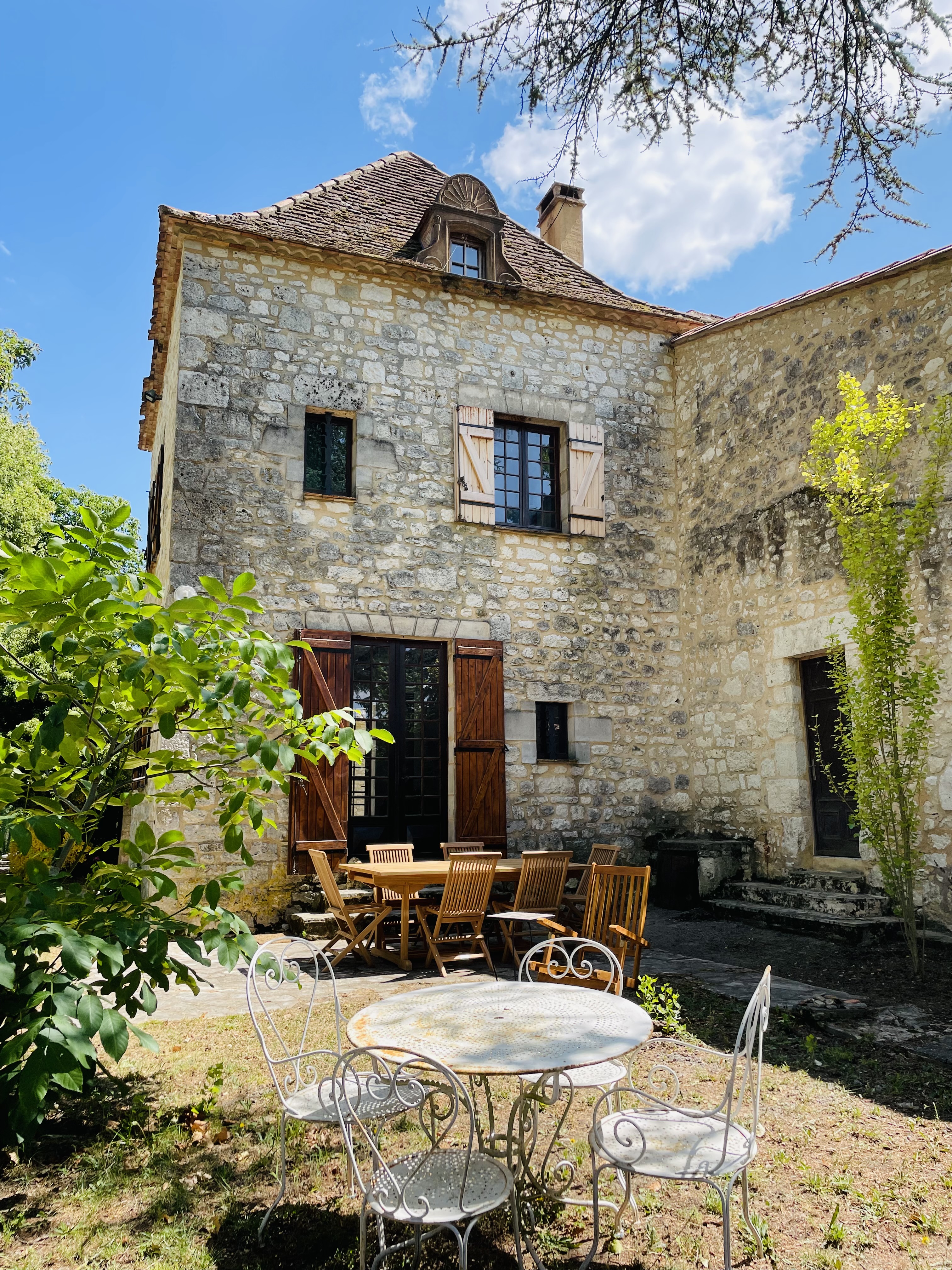 Le Pigeonnier — converted 19th-century dovecote, carved stone dormer