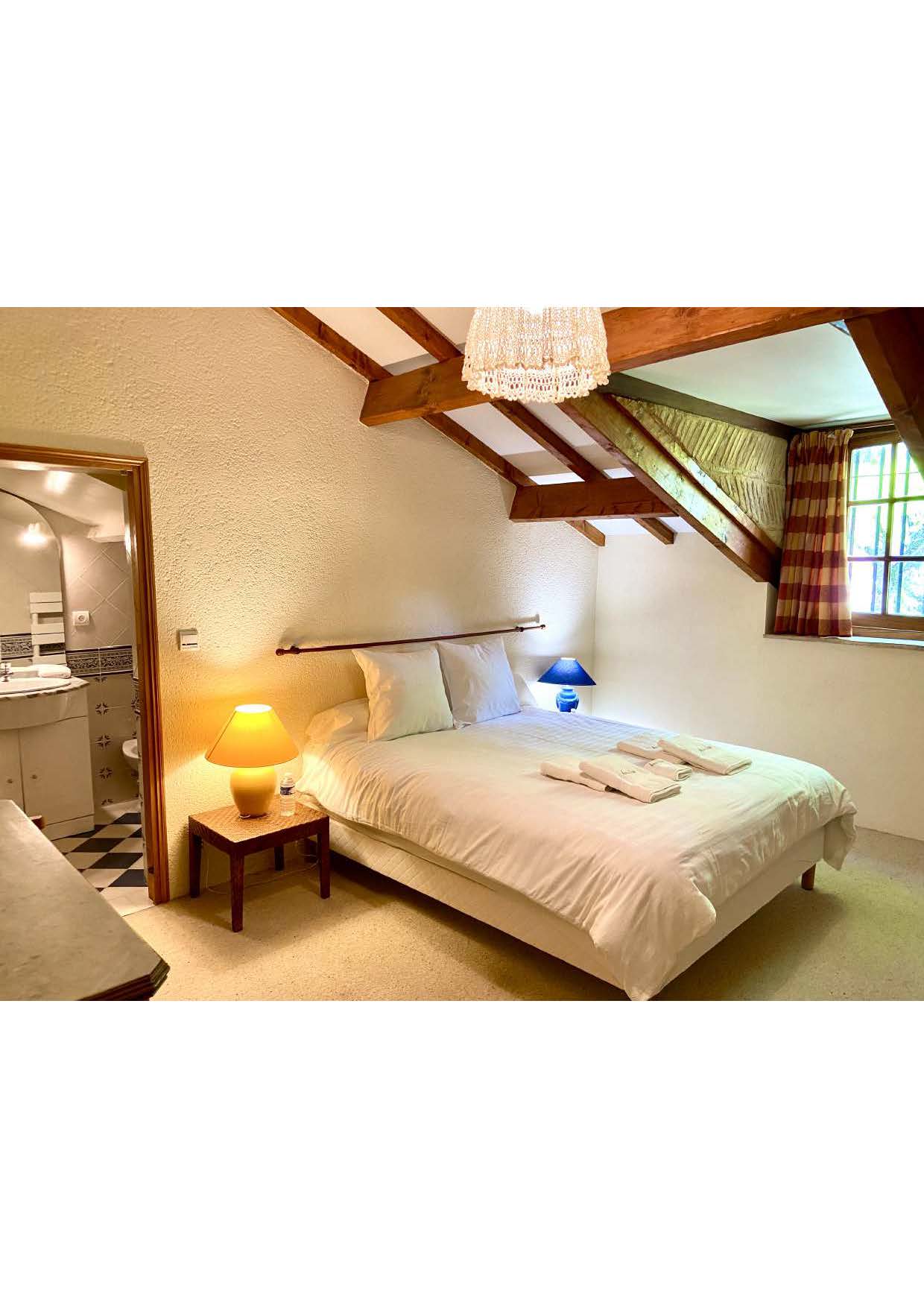 Bedroom five at Maison des Tournesols, with its adjoining shower room