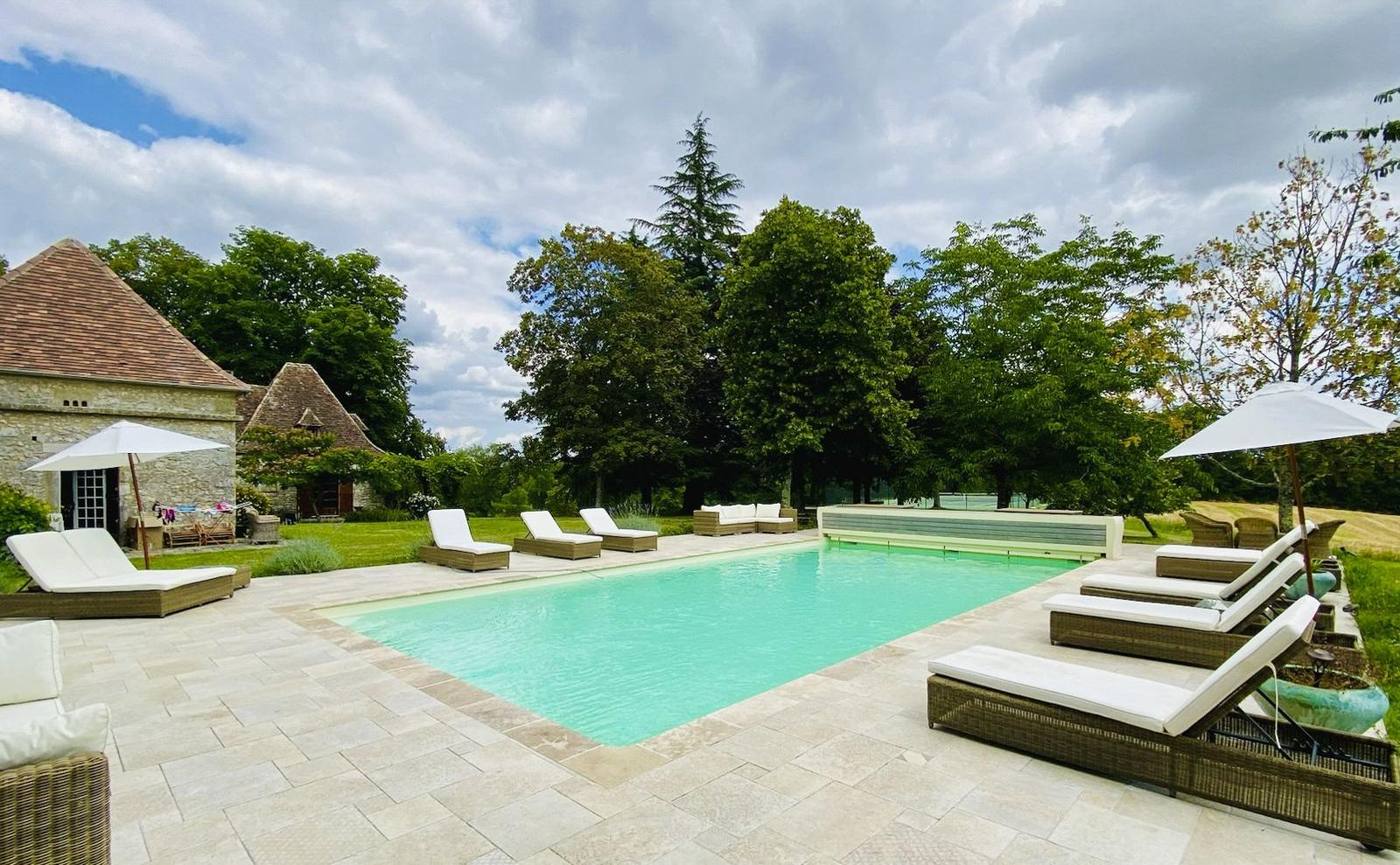 The pool and loungers on a summer afternoon