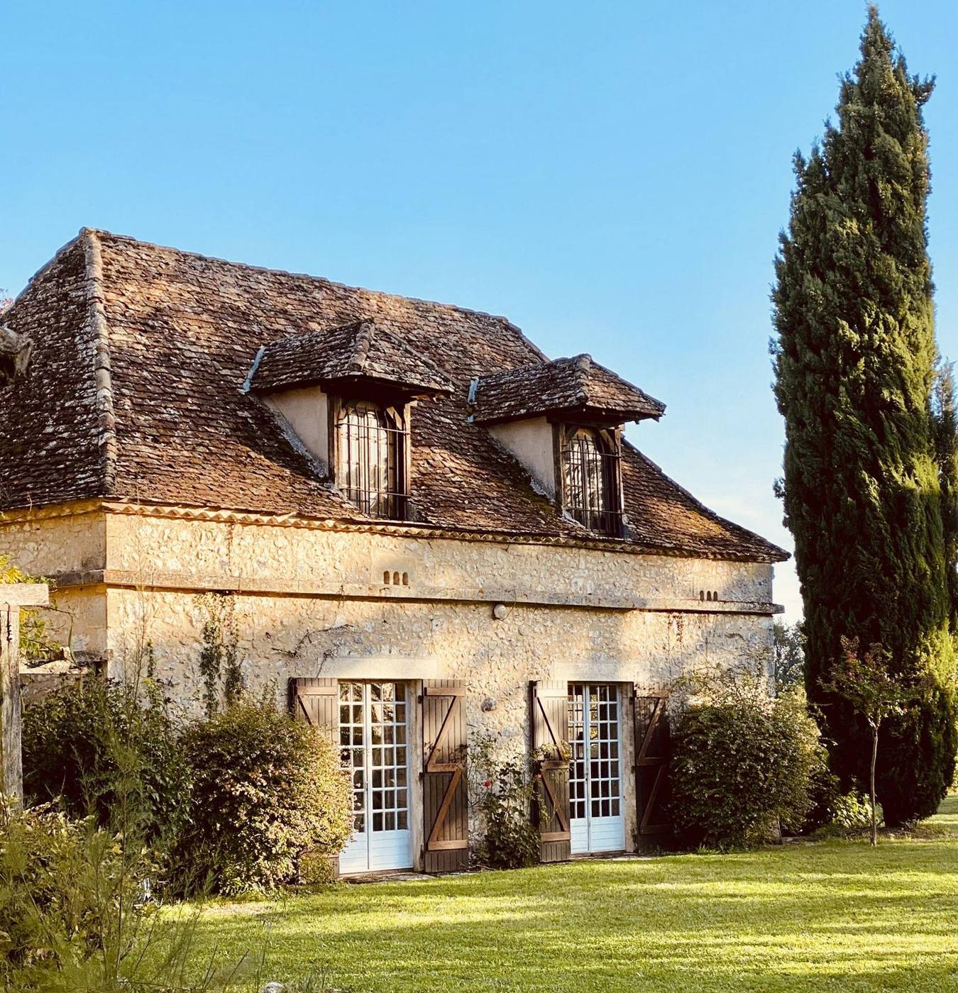 A stone house in spring sunshine