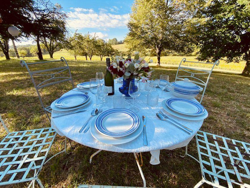 A table laid for lunch under the trees